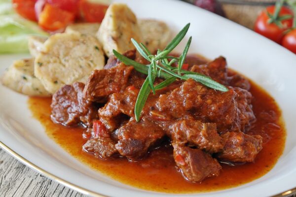A picture of cooking with wine, goulash.