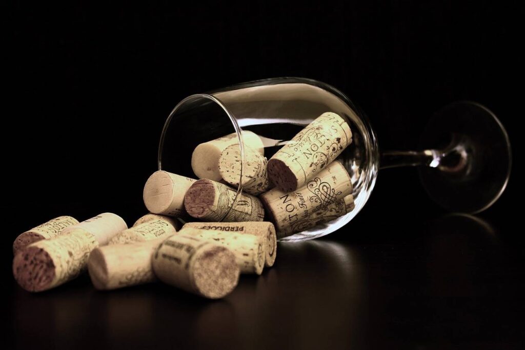 A photo of wine corks in a wine glass.