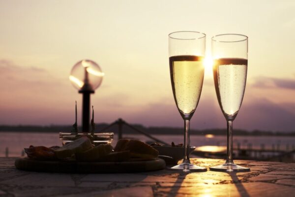 Two glasses of prosecco at sunset.