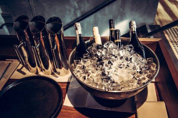 A picture of wine bottles in a wine cooler.