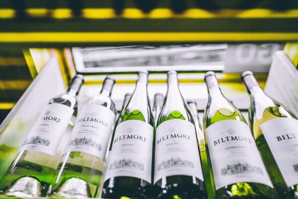 A picture of white wine in a wine fridge.
