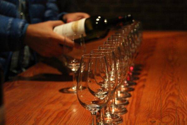 A photo of wine glasses at a wine tasting.